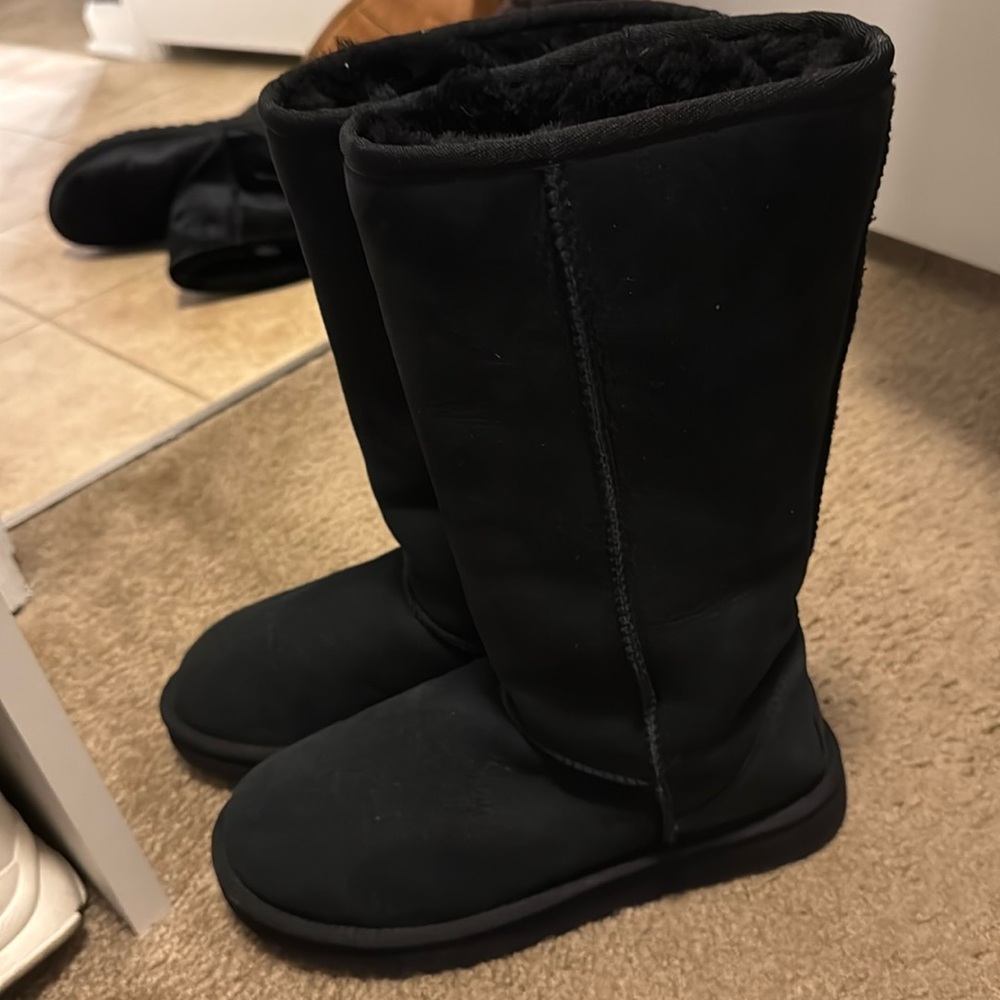 Used tall black Uggs. Still in good condition.